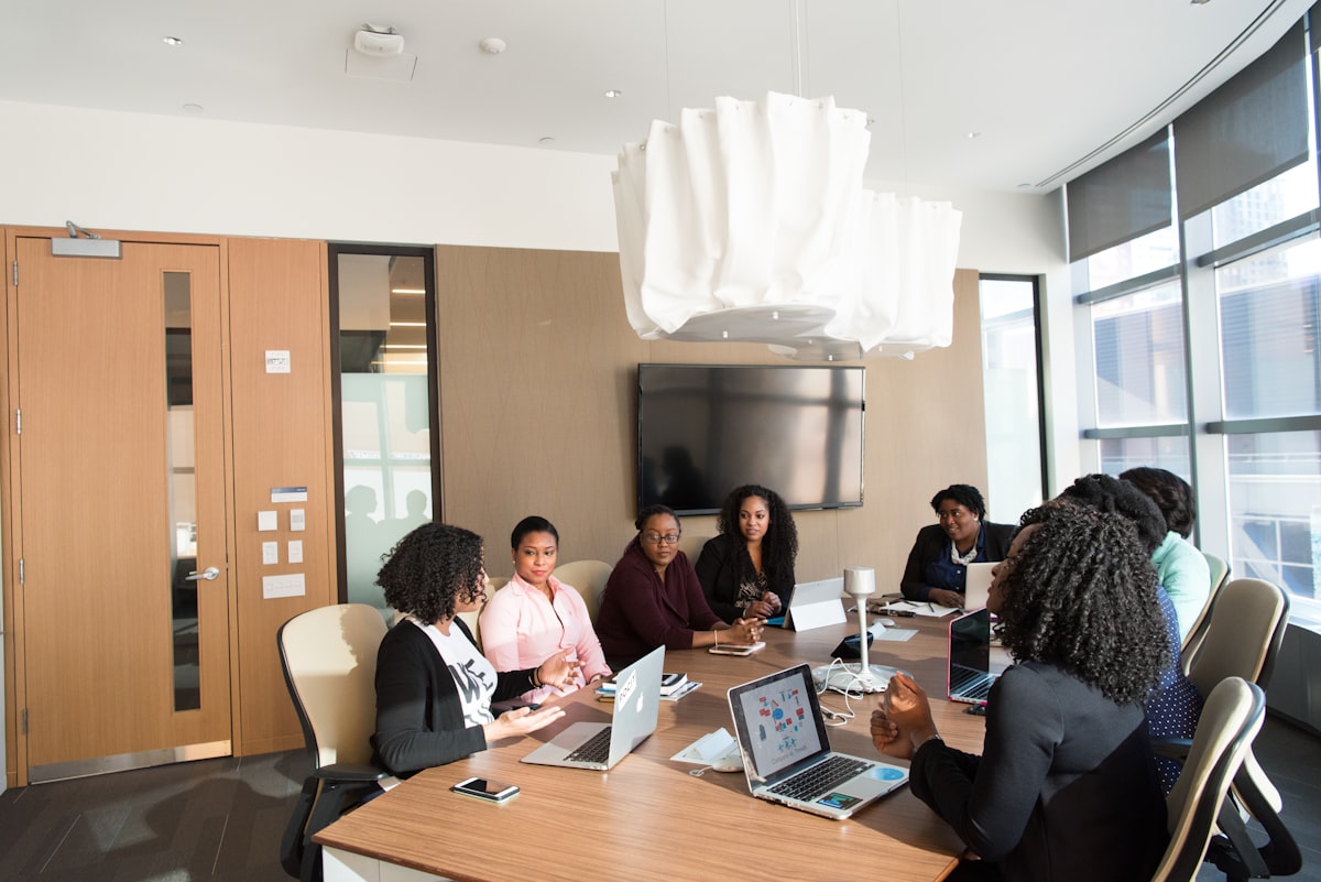 Team members collaborating around a table in a modern office